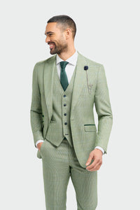 Man wearing a light green checkered suit with a white shirt and green tie on a white background